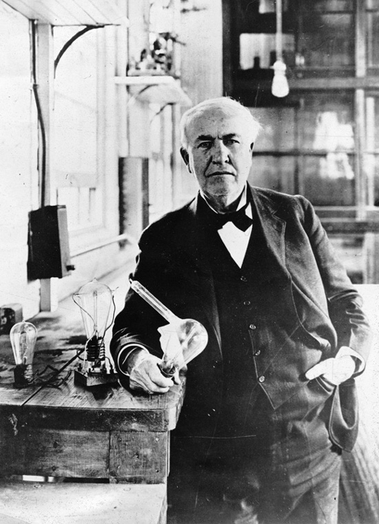 Edison in the lab demonstrating his lightbulbs