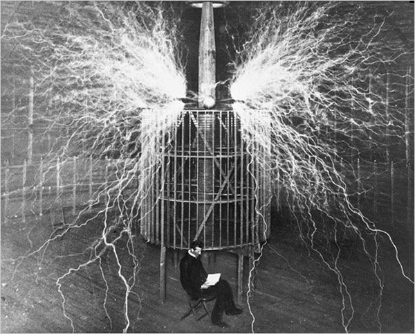 Nikola Tesla at work in his laboratory