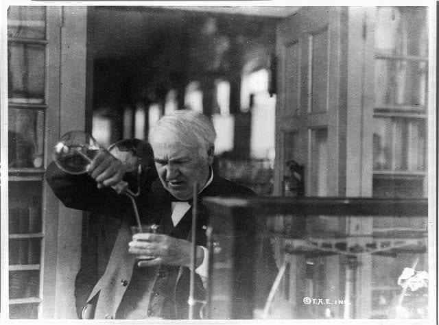 Thomas Edison experimenting in his laboratory