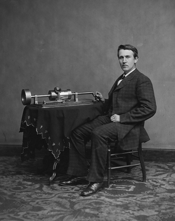 Edison posing with his famous phonograph invention